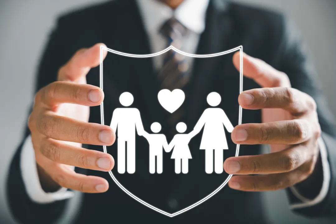 213228218_m Businessman with protective gesture ensures family security, incorporating life, health, and house coverage